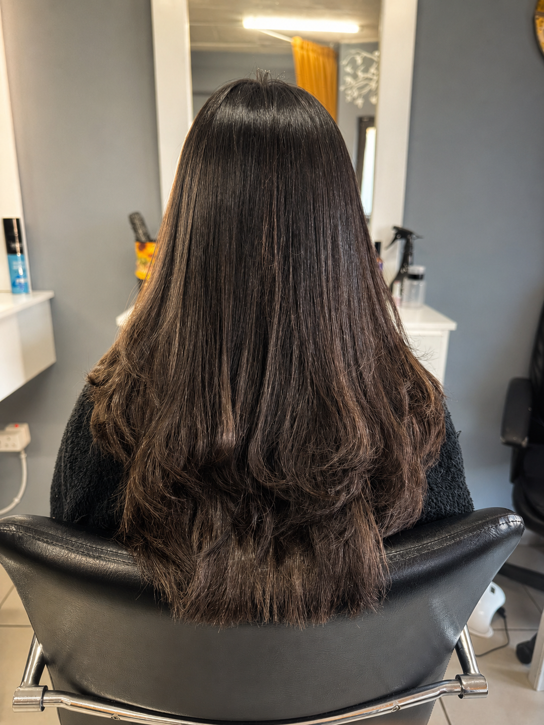 Studio 7 hair transformation after treatment, showing a smooth layered finish